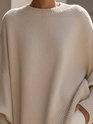 Poncho femme oversize beige en maille, col rond côtelé et empiècement asymétrique