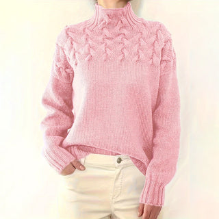 Pull en tricot rose clair à col roulé, manches longues, motif torsadé en relief