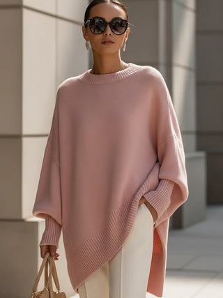 Poncho femme oversize rose poudré en maille, encolure ronde et bord côtelé
