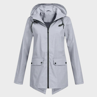 Manteau imperméable à capuche gris clair avec fermeture zippée et poches plaquées