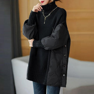 Pull oversize à col montant noir, coupe longue avec empiècement matelassé sur l’avant