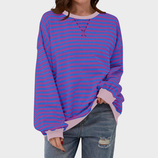 Pull décontracté rayé violet et rose, encolure en V, manches longues, coupe ample.