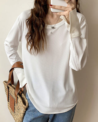 Pull en maille côtelée blanc, manches longues avec poignets boutonnés, encolure ronde