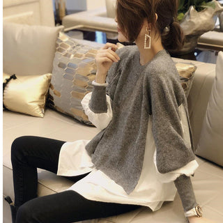 Pull gris ample en maille, col rond, manches bouffantes et bas volanté superposé