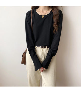 Pull en maille côtelée noir à manches longues, encolure ronde boutonnée