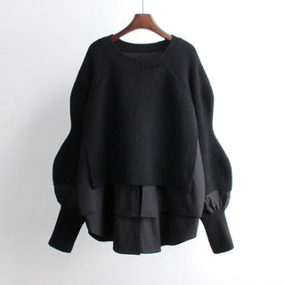 Pull noir en maille, encolure ronde et manches bouffantes, coupe ample