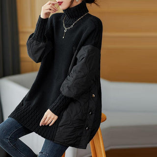 Pull oversize à col montant noir, finitions côtelées et poches sur les manches