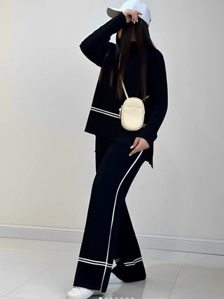 Ensemble Kendall noir : blouse et pantalon long évasé, bandes blanches sur la jambe.