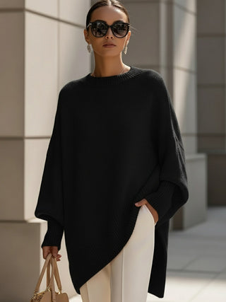Poncho femme oversize noir en maille, encolure ronde et bord côtelé