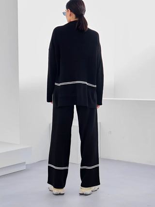 Ensemble Kendall noir, vue de dos : blouse et pantalon long avec bandes contrastées blanches.