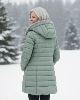 Veste matelassée vert clair à capuche, vue de dos, fermeture zippée.