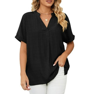 Blouse Ruby Fresh noire à col V, manches courtes, coupe ample en tissu léger.