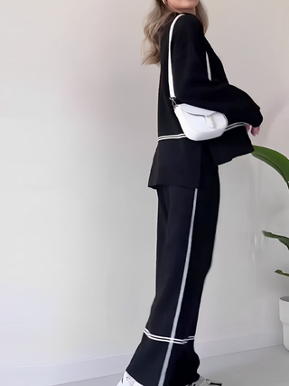Ensemble Kendall noir : blouse manches longues et pantalon évasé avec bandes contrastées.