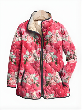 Veste matelassée ASTRID™ à imprimé floral rose, col avec doublure beige, boutons