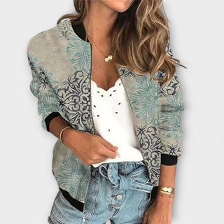 Veste avec fermeture zippée, manches longues, tissu beige clair avec motifs floraux bleus-verts