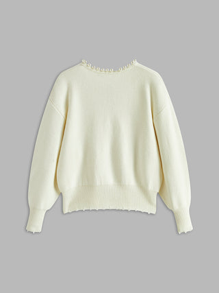 Cardigan en tricot crème, dos lisse, col ras-du-cou, finition ourlet côtelée