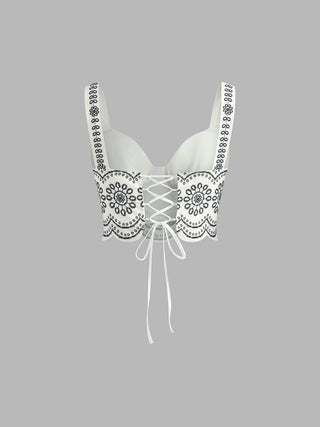 Bustier en lin brodé noir, laçage central, bretelles et bordures florales