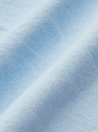 Tissu en lin bleu clair, gros plan de la texture