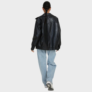 Veste en cuir noire vue de dos, col montant, poignets et taille resserrés