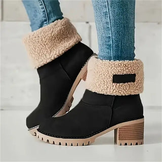 Bottes mi-mollet noires à col en fausse fourrure beige, talon bloc et semelle à crampons.