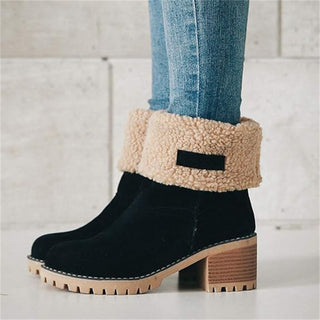 Bottes mi-mollet noires à col en fausse fourrure beige, talon bloc et semelle crantée.