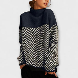 Pull à col montant bleu marine, empiècement chevrons noir et beige, manches longues