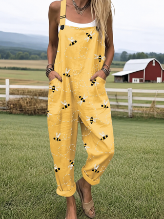 Combinaison jaune à bretelles fines, poches, motif d’abeilles