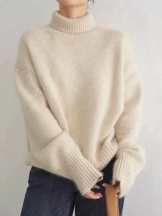 Pull en cachemire beige à col haut, manches longues, poignets côtelés et base rib