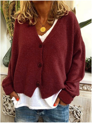 Cardigan femme rouge foncé à col en V, boutons au devant, manches longues amples.
