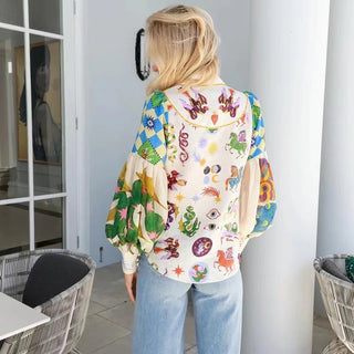 Blouse blanche imprimée, vue de dos avec col et manches bouffantes volumineuses