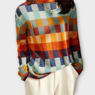 Pull à col rond à carreaux colorés, coupe longue avec bas côtelé.
