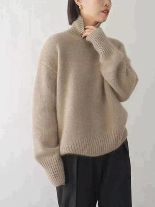 Pull en cachemire beige à col haut, manches longues, base côtelée, coupe ample