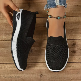 Chaussures confort orthopédiques Lia™ noires, semelle blanche, tige en tricot.