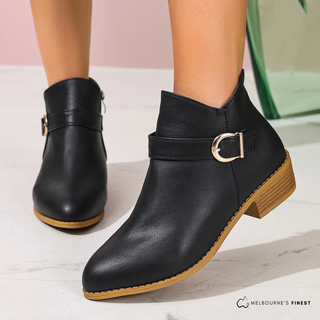 Boots mi-mollet noires en cuir avec bride et boucle métal