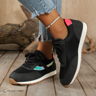 Chaussures orthopédiques Elisa™ noires à lacets, semelle blanche et bande turquoise.