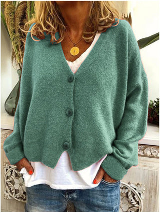 Cardigan femme vert clair à col en V, boutonné au devant, manches longues amples.