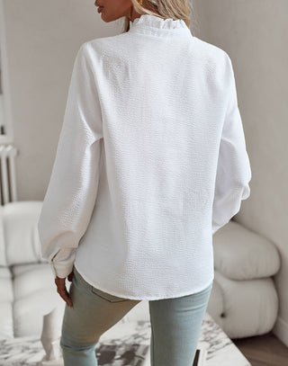 Chemise casual blanche, vue de dos, col montant boutonné et manches longues amples.