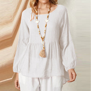 Blouse peplum blanche à manches bouffantes, encolure ronde, taille froncée