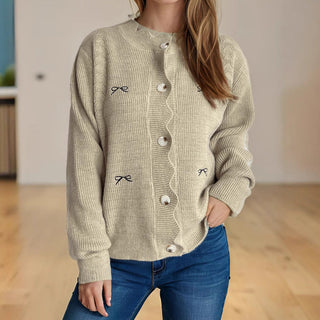 Cardigan en maille épaisse kaki à boutons et bord côtelé, motifs nœud visibles