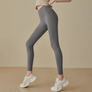 Leggings taille haute gris, coupe près du corps, coutures galbantes et jambes ajustées