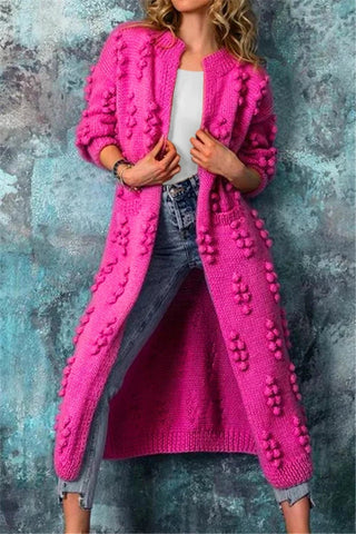 Cardigan long ouvert en tricot texturé rose vif, motifs en relief sur l’avant, manches 3/4