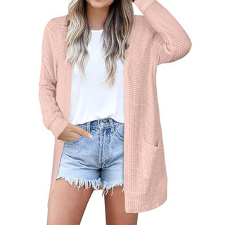 Cardigan long ouvert en tricot gaufré rose, manches longues et poches plaquées