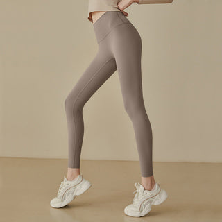 Leggings taille haute taupe, coupe près du corps, coutures galbantes et jambes ajustées