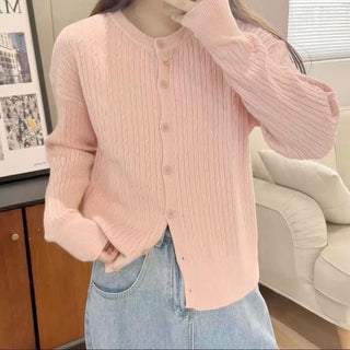 Cardigan en tricot à torsades rose pâle, boutonné, coupe décontractée