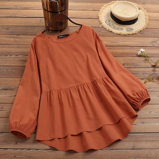 Blouse peplum orange à manches bouffantes, volant évasé, coupe ample