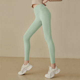 Leggings taille haute vert clair, coupe près du corps, coutures galbantes et jambes ajustées
