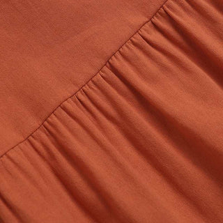 Tissu de blouse peplum orange : couture froncée et volant au bas