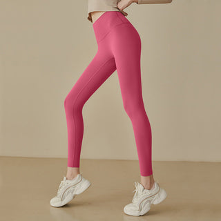 Leggings taille haute rose fluo, coupe près du corps, coutures galbantes et jambes ajustées