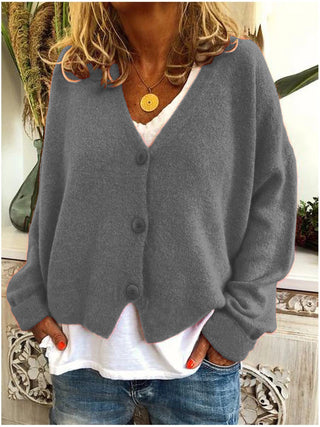 Cardigan femme gris à col en V, boutons devant, manches longues amples.