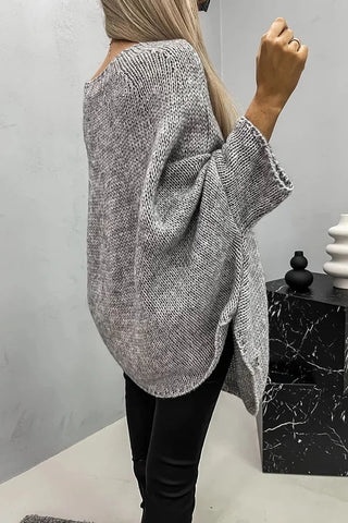 Poncho-blouse en tricot côtelé gris, vue de côté, manches chauve-souris, col rond